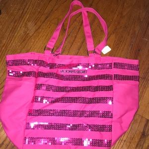 Victoria’s Secret pink sparkle tote bag.